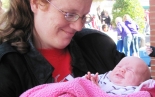 HRS resident and new mom, Bridgett, with her tiny daughter Scarlet.